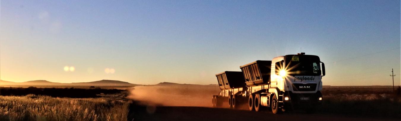 A Payloads interlink hauling side tippers at first light